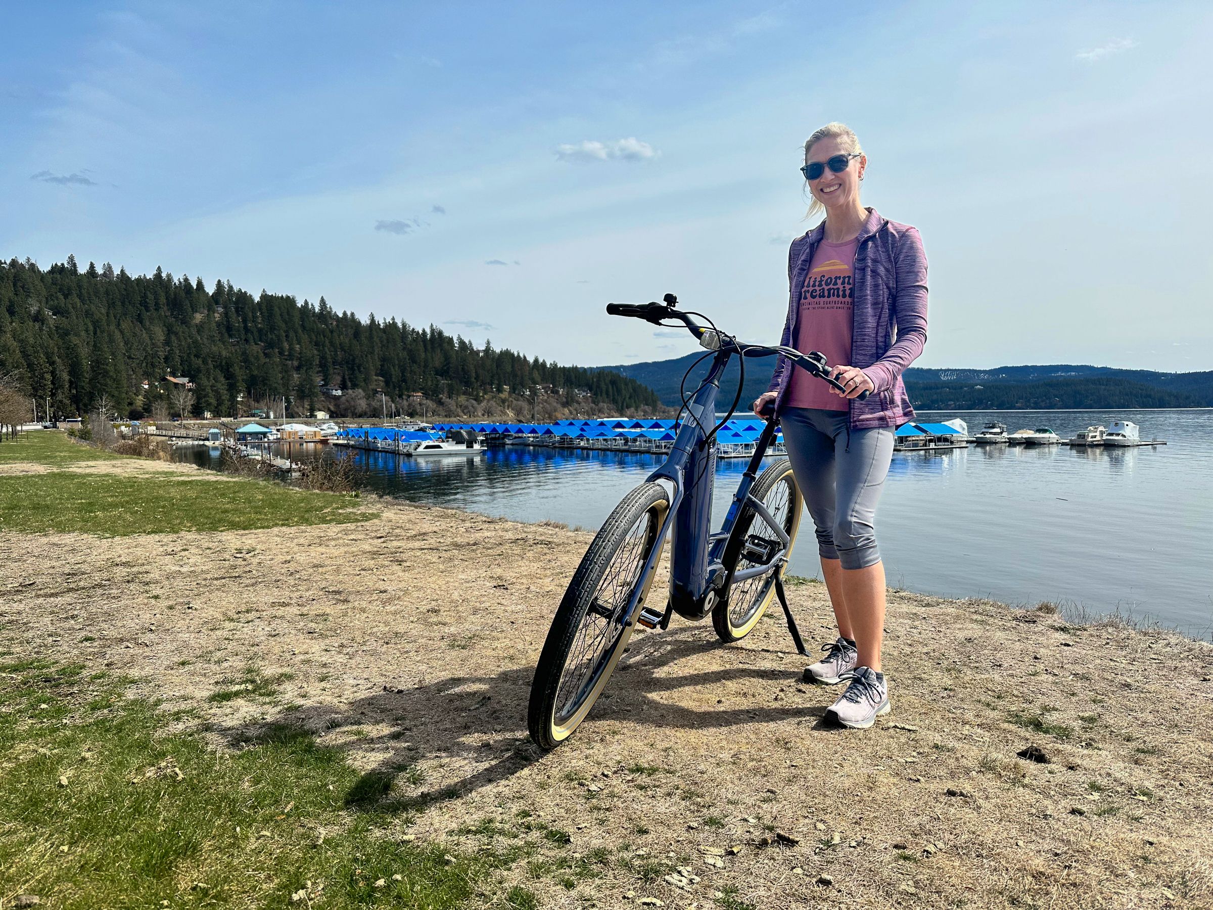 Emily Buscema riding a bike along Lake Coeur d'Alene